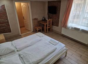 Postel nebo postele na pokoji v ubytování Sun Hotel