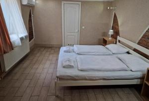 Postel nebo postele na pokoji v ubytování Sun Hotel