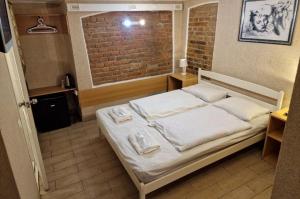 Postel nebo postele na pokoji v ubytování Sun Hotel