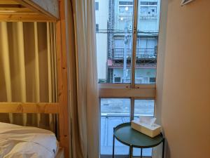 Ліжко або ліжка в номері Tomarotto Hostel