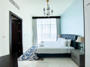 a bedroom with a large bed and a window at Stylish 1-Bedroom-Sleeps 4- Apartment -Bayz by Danube, Business Bay-29 in Dubai +36 photos