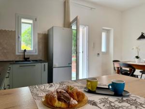 a kitchen with a table with a plate of food on it at Casa Baglio Monti in Palermo +24 photos