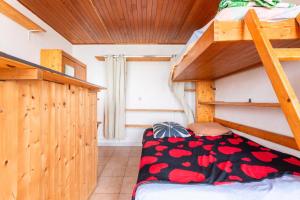 En eller flere senge i et værelse på Appartement Escaliers