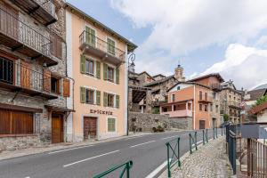 an empty street in a town with buildings at La maison d'Acoya in Valdeblore