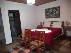 Ένα ή περισσότερα κρεβάτια σε δωμάτιο στο Chalés vale da mata +5 φωτογραφίες