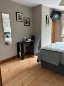 Ένα ή περισσότερα κρεβάτια σε δωμάτιο στο Davmar House Blarney