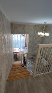 a staircase in a room with a stair case at BURABAY Promenade Solo in Borovoye