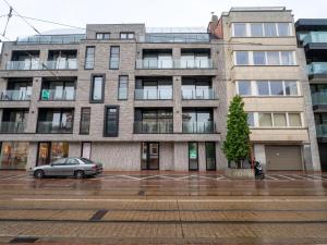 a car parked in a parking lot in front of a building at Apartment Elyana with balcony by Interhome in Blankenberge