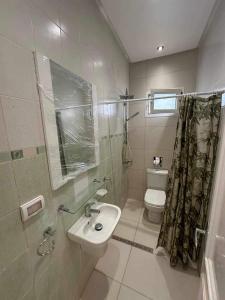 a bathroom with a sink and a toilet at villa meublé in Tunis +9 photos