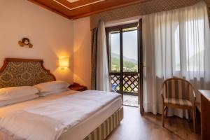 Postel nebo postele na pokoji v ubytování Hotel Sporting
