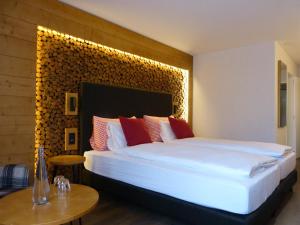 Postel nebo postele na pokoji v ubytování Hotel Steinmattli