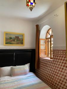 Postel nebo postele na pokoji v ubytování Riad dar Rhamna