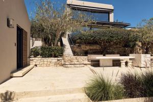 A garden outside OPENNESS House by the sea