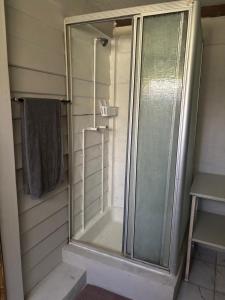 a shower with a glass door in a bathroom at Jorstel in Grootvlei +17 photos