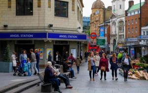 a group of people walking on a busy city street at Central London Stays in London +3 photos