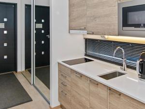 Kuchyň nebo kuchyňský kout v ubytování Holiday Home Lomahuoneisto 64 by Interhome + 7 fotografií