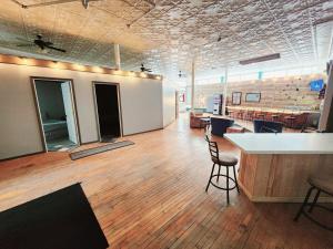 a large room with a bar and chairs in it at Kaleva East & Goose's Hall in South Range