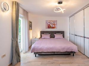 Ένα ή περισσότερα κρεβάτια σε δωμάτιο στο Apartment Mihaela-1 by Interhome