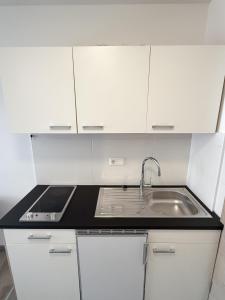 Η κουζίνα ή μικρή κουζίνα στο Residence Laurin Apartments