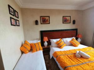 Voodi või voodid majutusasutuse Riad Rayhana De L Atlas toas