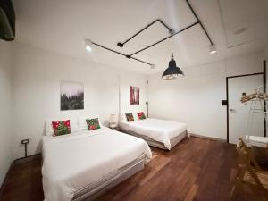 Ένα ή περισσότερα κρεβάτια σε δωμάτιο στο Dominol House l 5 min to Nimman l MAYA l Old Town l 附近的房子