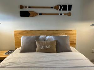 a bedroom with a bed with a wooden headboard at B1 Serenity Terraces, Beach Hotel- Kokrobite in Kokrobite