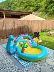 a childs play set with an inflatablevisorangering at くつろ郷Kutsuro-go in Kawatana