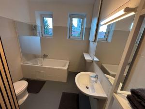 a small bathroom with a sink and a toilet at City Apartment 8 JOSEF 3rd Floor 44 m2 in Graz