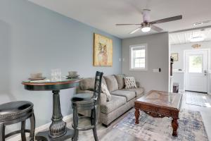 a living room with a couch and a table at Shared Boat Ramp at Kentucky Lake Retreat in New Johnsonville
