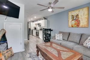 a living room with a couch and a ceiling fan at Shared Boat Ramp at Kentucky Lake Retreat in New Johnsonville
