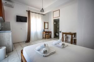 Postel nebo postele na pokoji v ubytování Galini Apartments