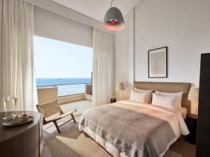Кровать или кровати в номере Grecotel Astir Palace