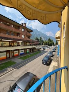 a view of a street with cars parked on the road at Residence Armonia in Boario Terme +43 photos