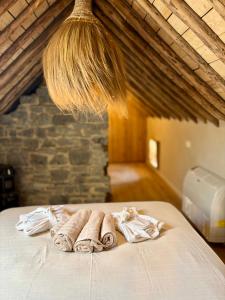a group of towels on a bed in a room at Au ptit Gaston in Durbuy