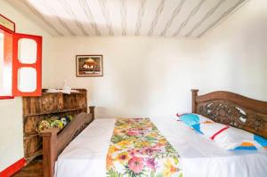 Ένα ή περισσότερα κρεβάτια σε δωμάτιο στο Hotel Bellavista Pance