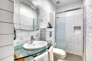 a bathroom with a sink and a toilet at Hôtel Mistral Saint Roch in Montpellier