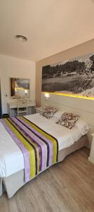 Postel nebo postele na pokoji v ubytování Hotel Venecia Paguera