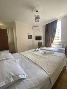 Postel nebo postele na pokoji v ubytování Guest House Deme