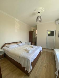 Postel nebo postele na pokoji v ubytování Guest House Deme