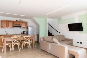 a living room with a couch and a table at Portola la vecchia dimora in Roncola