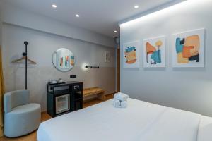 Ein Bett oder Betten in einem Zimmer der Unterkunft PAREA Athens