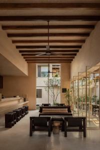Postel nebo postele na pokoji v ubytování NABOA Hotel Tulum