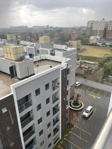 an aerial view of a building with a parking lot at Hideaway holiday in Nairobi