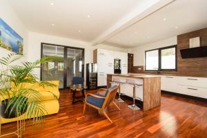 a living room with a yellow couch and a table at Villa Simon2 in Veliko Brdo
