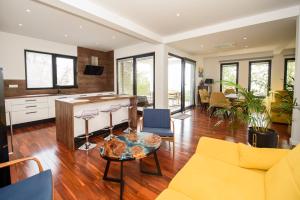 a living room with a couch and a table at Villa Simon2 in Veliko Brdo