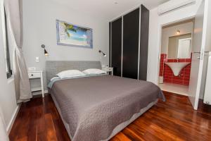 a bedroom with a large bed and a bathroom at Villa Simon2 in Veliko Brdo +20 photos