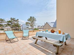 a patio with a table and two chairs on a balcony at Holiday Home La Surprise by Interhome in Saint-Germain-sur-Ay
