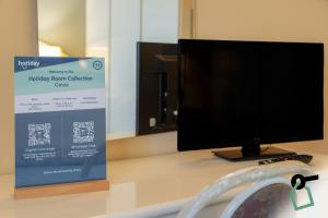 TV a/nebo společenská místnost v ubytování HOTIDAY Room Collection - Cinisi