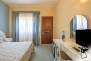 Postel nebo postele na pokoji v ubytování HOTIDAY Room Collection - Cinisi