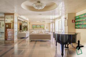 Posezení v ubytování HOTIDAY Room Collection - Cinisi